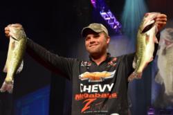 Luke Clausen proudly displays his second-place catch. Clausen jumped from 11th place on day two to the runner-up position heading into the finals.