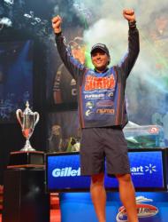 Scott Martin raises his arms in victory shortly after winning the 2011 Forrest Wood Cup title on Lake Ouachita.