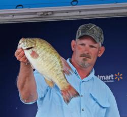 Second-place co-angler Milton Goff shows off a nice smallie on day three.