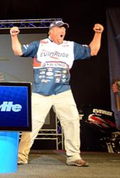Pro Tommy Skarlis of Waukon, Iowa, reacts to his day-three partner Todd Dankert of Anoka, Minn., winning the co-angler title at the National Guard FLW Walleye Tour Championship on the Missouri River.