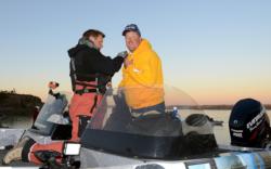 Evinrude pro Tommy Skarlis is outfitted with a microphone for TV production prior to takeoff.