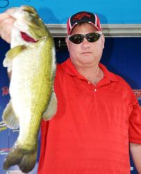 Vince Denina of Willis, Texas, finished the day tied for fifth place. He also took home the day's big bass award in the Co-angler Division with a 5-pound, 7-ounce catch. 