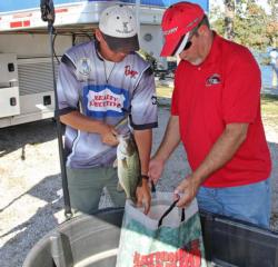 After resuming the pro division lead, Robbie Dodson puts his fish back into a bag of water and Rejuvenade.