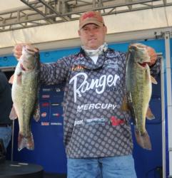 Third-place pro Robert Behrle holds up a pair of 5-pound largmouths.