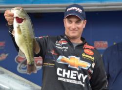 Fourth-place pro Anthony Gagliardi holds up his biggest bass from day four on Lake Guntersville.