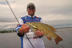FLW Tour pro David Wolak shows off his catch on 1000 Islands.