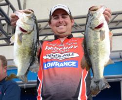 Third-place pro John Cox holds up a pair of Okeechobee giants caught flipping.