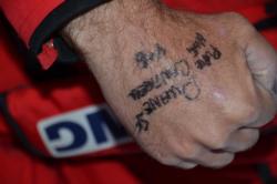Marty Stone reveals his hand-inscribed tournament dedication to a friend who recently lost his life in a house fire.