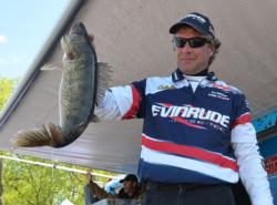 Fifth-place pro Joe Whitten holds up his biggest walleye from day two on the Mississippi River.