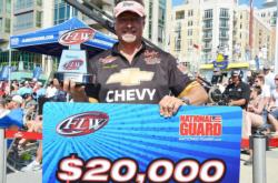 Chris Dillow of Waynesboro, Va., holds up his winning check after capturing the FLW Tour Co-angler Division title on the Potomac River.