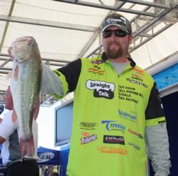 JT Kenney holds up the 6-pound, 5-ouncer that tied him for day-two big-bass honors and helped propel him to second place.