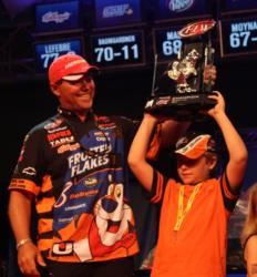 Dave Lefebre gives his son, Mitchell, a chance to hoist the winner
