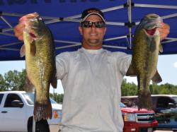 Second-place pro Paul Malone holds up a pair of nice Mississippi River largemouths.