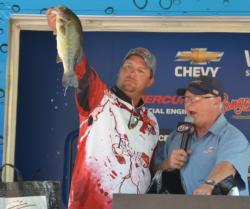 Second-place finisher Zach King holds up his biggest bass from the final day.