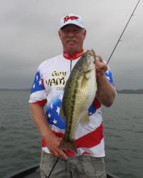 Tom Mann Jr. holds up a nice Lake Lanier spotted bass.
