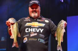 Chevy pro Dion Hibdon proudly displays his catch.