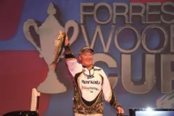 Forrest Wood Cup champion Timothy Dearing proudly displays one of his fish on his way to the scale.