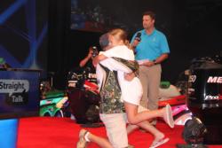 Top co-angler Timothy Dearing gets a victory hug from his daughter, Harley.