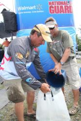 Canadian pro Derek Strub gets a bucket of water on his leading bag of fish.