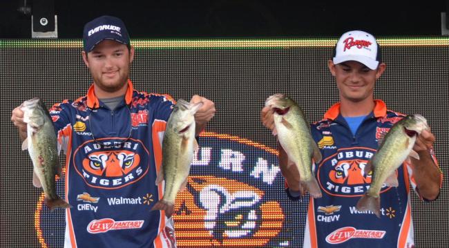 Auburn anglers Shane Powell and Jordan Lee hold up part of their 11-pound, 8-ounce catch Saturday.