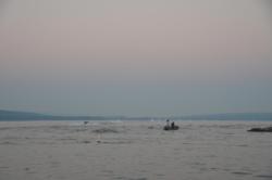 The convoy of rooster tails from the boats head up the lake in search of bigger fish. 
