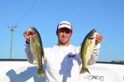 Co-angler leader Patrick Stines holds up a pair of spots that were part of his 11-pound, 1-ounce bag. 