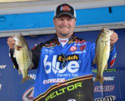 Third-place pro Ray Scheide holds up his two largest fish from day three on Smith Lake.  