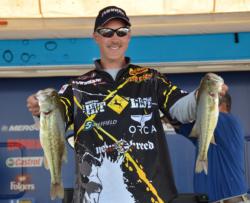 Third-place finisher Andy Morgan holds up a pair of Smith Lake largemouths.