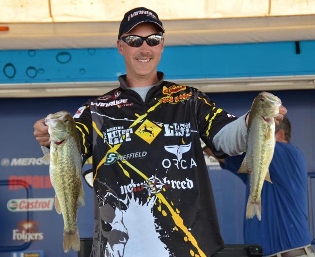 Third-place finisher Andy Morgan holds up a pair of Smith Lake largemouths.