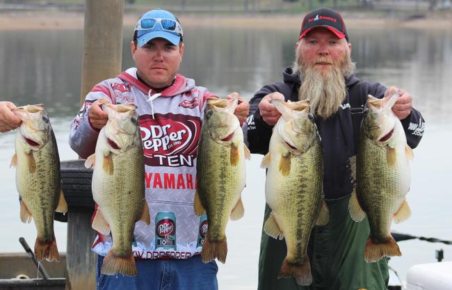 Rogne Brown (pictured right) of Hixson, Tenn., holds up his 40-pound, 14-ounce Chickamauga stringer, a new BFL record.