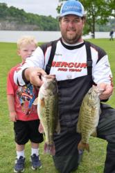 Pro Todd Rasberry of Killen, Ala., shows off his fifth-place catch during the second day of EverStart Series Central Division competition on Pickwick Lake.