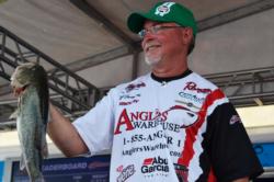 Keith Honeycutt of Temple, Texas, shows off part of his three-day catch of 45 pounds, 13 ounces en route to a first-place finish on Grand Lake.