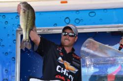 Chevy pro Bryan Thrift of Shelby, N.C., shows off his second-place catch in the finals.