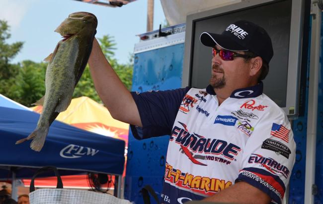 Second-place pro Dan Morehead holds up his biggest bass from day one on Lake Chickamauga.