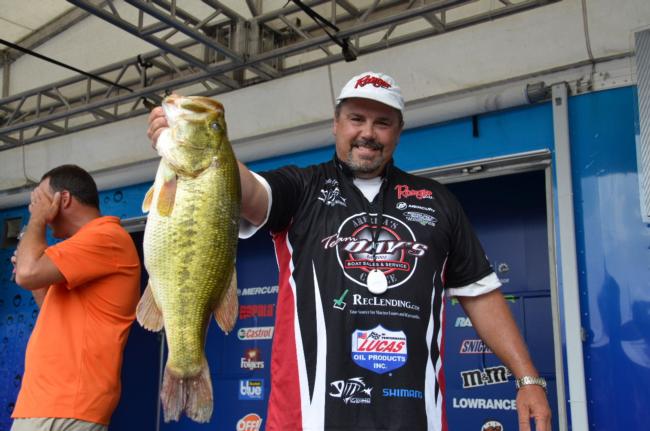 Bill Day not only took fifth place on day one with a 22-pound, 11-ounce limit, but he also had the 3M Scotch Blue Big Bass - a 8-13 monster. 