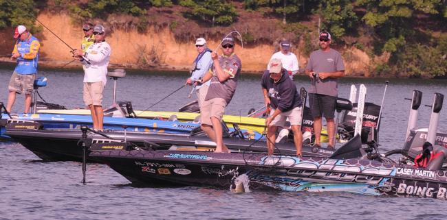 Casey Martin hauls in what he thinks is a giant bass..