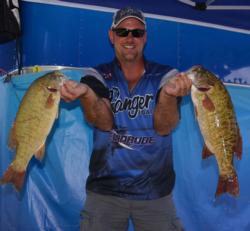 Co-angler leader Bryan Rupe holds up part of his 19-pound, 14-ounce stringer.