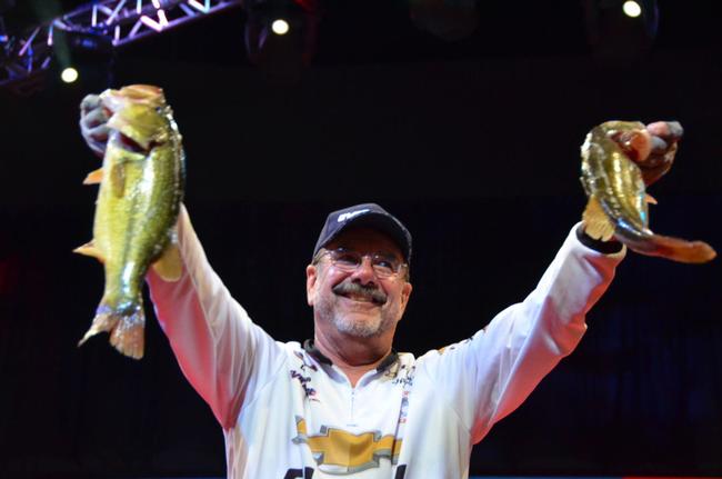 Chevy pro Larry Nixon proudly displays his third-place catch after day-one of Red River competition.