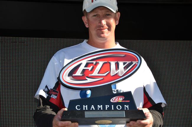 Pro Bryan Schmitt of Deale, Md., shows off his first-place trophy after winning the EverStart Series title on the Chesapeake Bay.