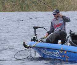 Brett Hite dealing with a bass that refuses to get in the net.