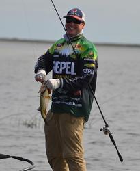 Cody Meyer laughs as he tosses back a 3-pound bass that won't help him. 