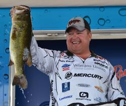 James Watson holds up the kicker that anchored his 20-pound, 15-ounce day-four stringer.