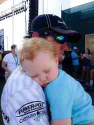 Stetson Blaylock holds his sleeping son, Kei right after final day weigh-in of the TTBC. 