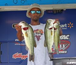 Sixth-place pro Omari Navies shows off his catch.