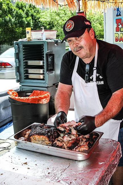 Butch Kelly, pitmaster at Butts-R-Us, said the key to pulled pork preparation is the personal touch.