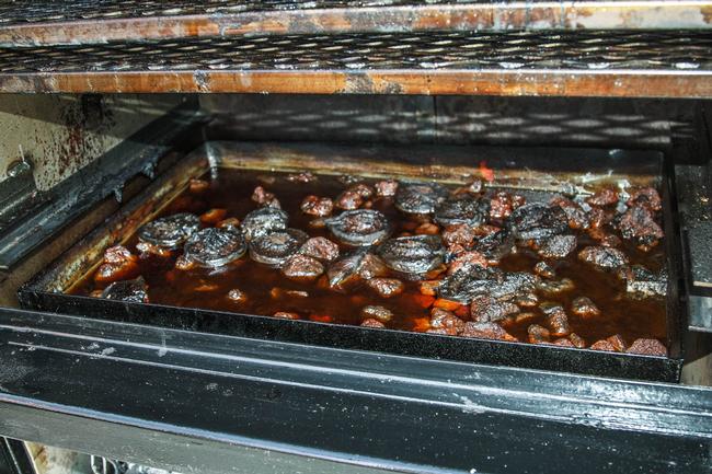 Here's a cool tip from Jason Hardee of Elite BBQ Smokers: Add cut peaches to your water pan for a sweeter smoke vapor.