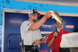 Joey Cifuentes of Clinton, Ark., shows off his winning Rayburn bass.
