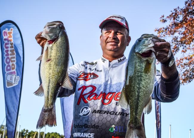 Todd Auten of Lake Wylie S.C., shows off part of his 15 pound sack caught on day one of the Rayovac FLW Series Championship on Wheeler Lake. He currently shits in fourth place. This is his second championship appearance. 