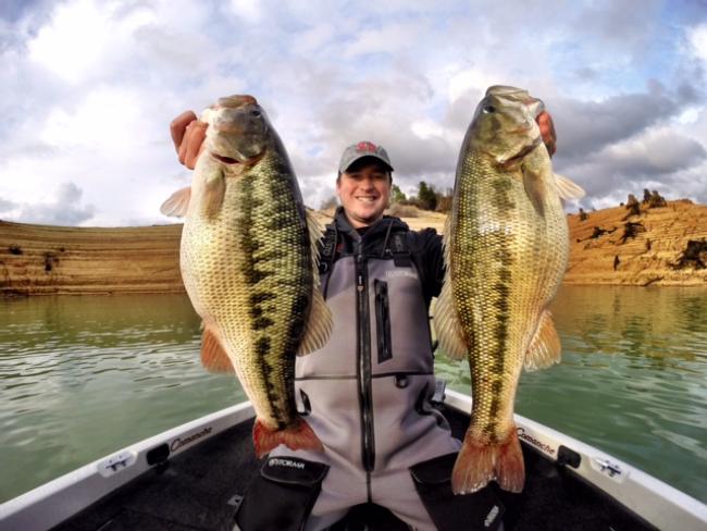 Meyer with a handful of beautiful spotted bass. 