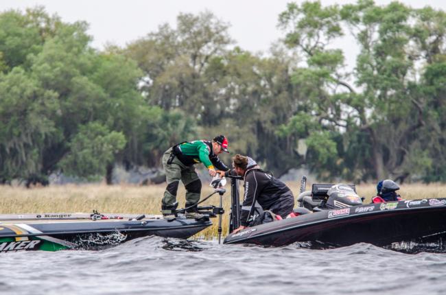 'You've Got a Friend' . . . Pro JT Kenny helps fellow pro Scott Canterbury out with a prop for his motor on day two of the Walmart FLW Tour on Lake Toho.